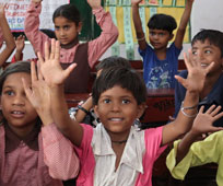 Grassroots accountability Kids waving